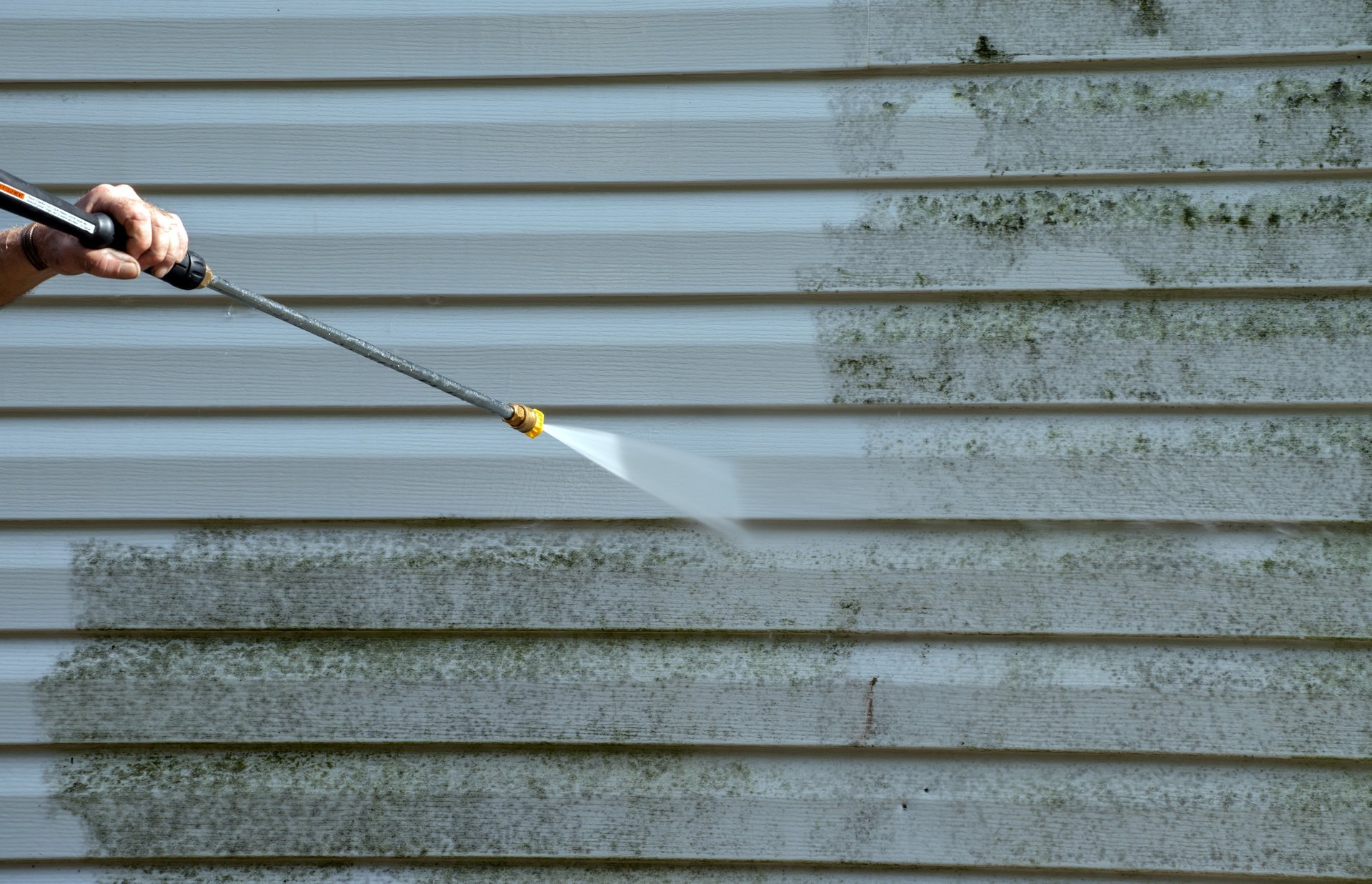 Professional pressure washing exterior house cleaning